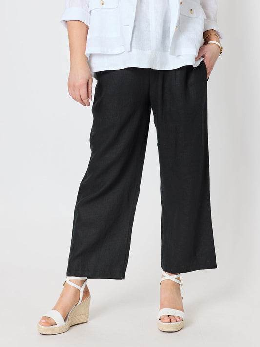Image of a model wearing Pants. Product name - Lara Wide Leg Linen Pant Black in Black colour by brand - Gordon Smith