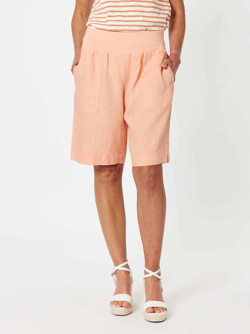 Image of a model wearing Shorts. Product name - Jordan Linen Short Mandarine in Mandarine colour by brand - Gordon Smith