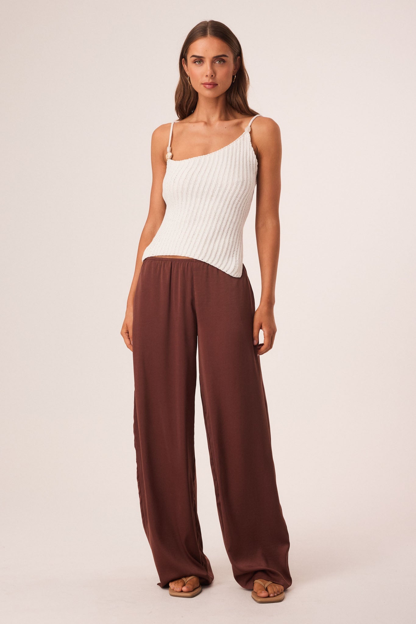 Image of a model wearing Tops. Productname: SNDYS DESI OPEN BACK TOP in White colour by brand - SNDYS