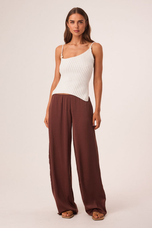 Image of a model wearing Tops. Productname: SNDYS DESI OPEN BACK TOP in White colour by brand - SNDYS