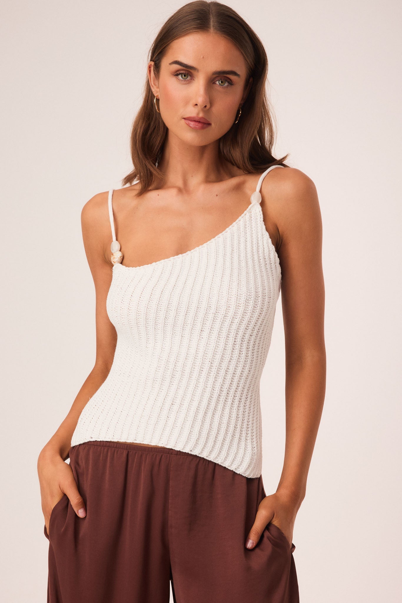 Image of a model wearing Tops. Productname: SNDYS DESI OPEN BACK TOP in White colour by brand - SNDYS