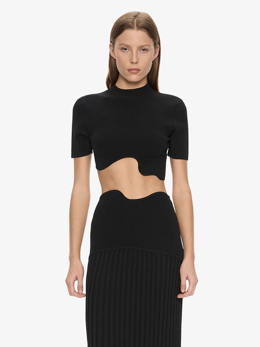 Image of a model wearing Tops. Product name - Maparadita Top in Black colour by brand - Christopher Esber