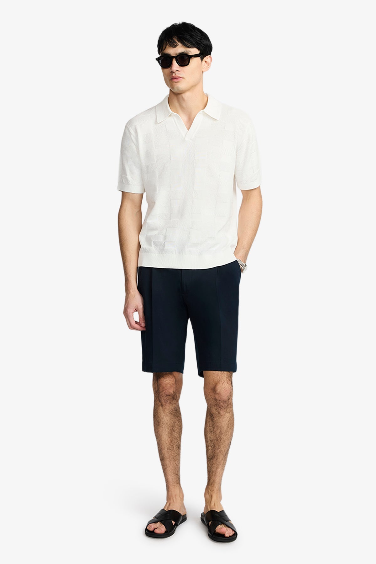 Image of a model wearing Tops. Product name - Array Off White Polo In Supima Cotton in White colour by brand - Anthony Squires