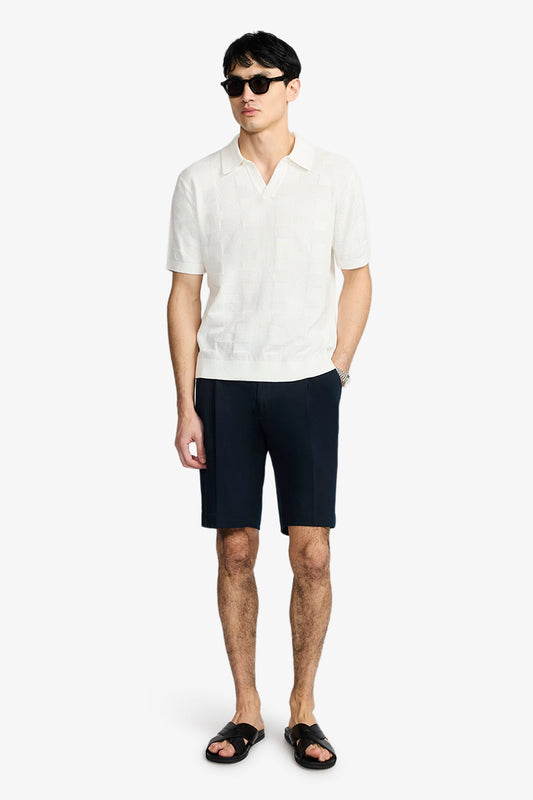 Image of a model wearing Tops. Product name - Array Off White Polo In Supima Cotton in White colour by brand - Anthony Squires