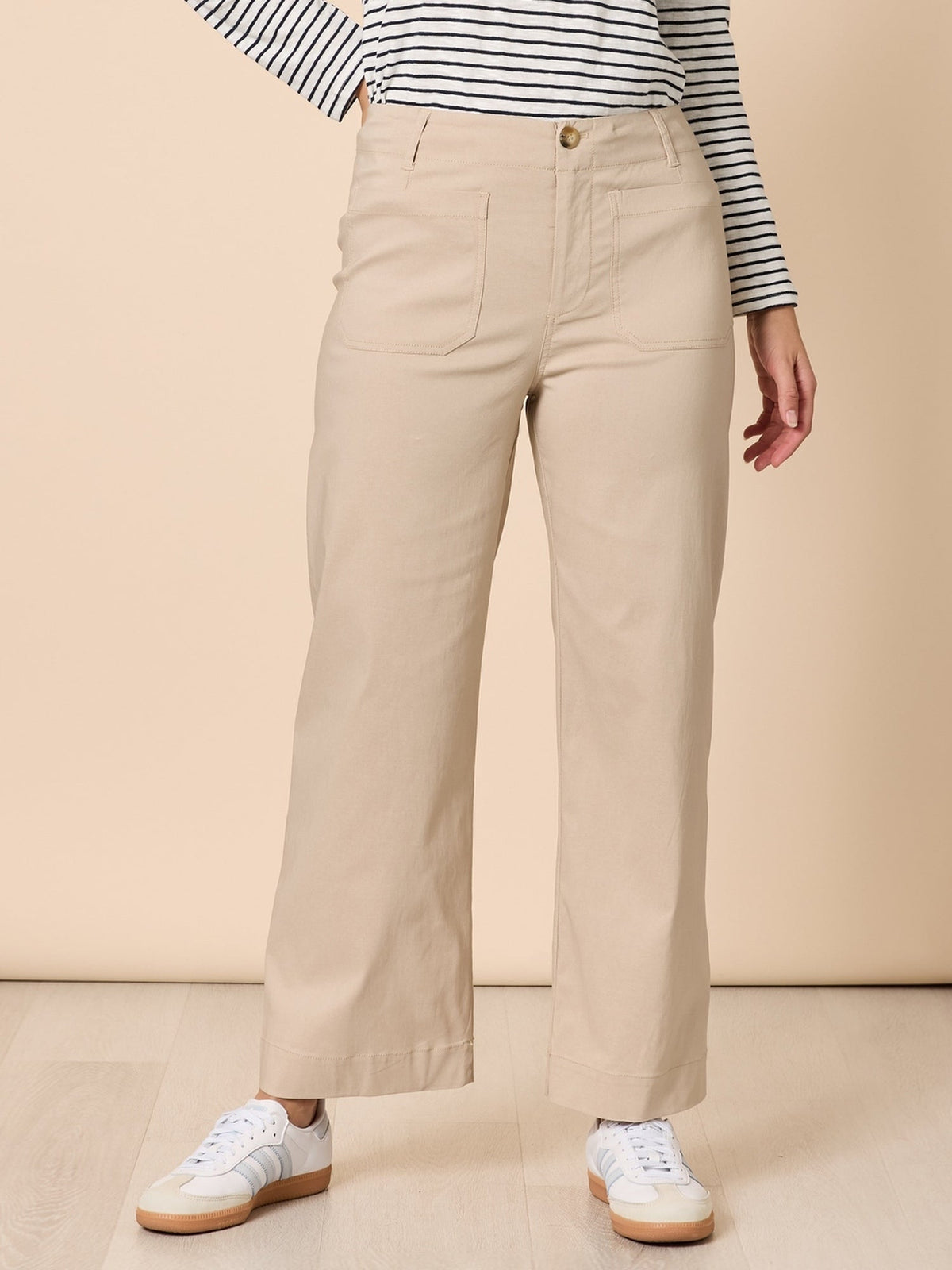 Image of a model wearing Pants. Product name - Marine Wide Leg Pant Natural in Natural colour by brand - Threadz
