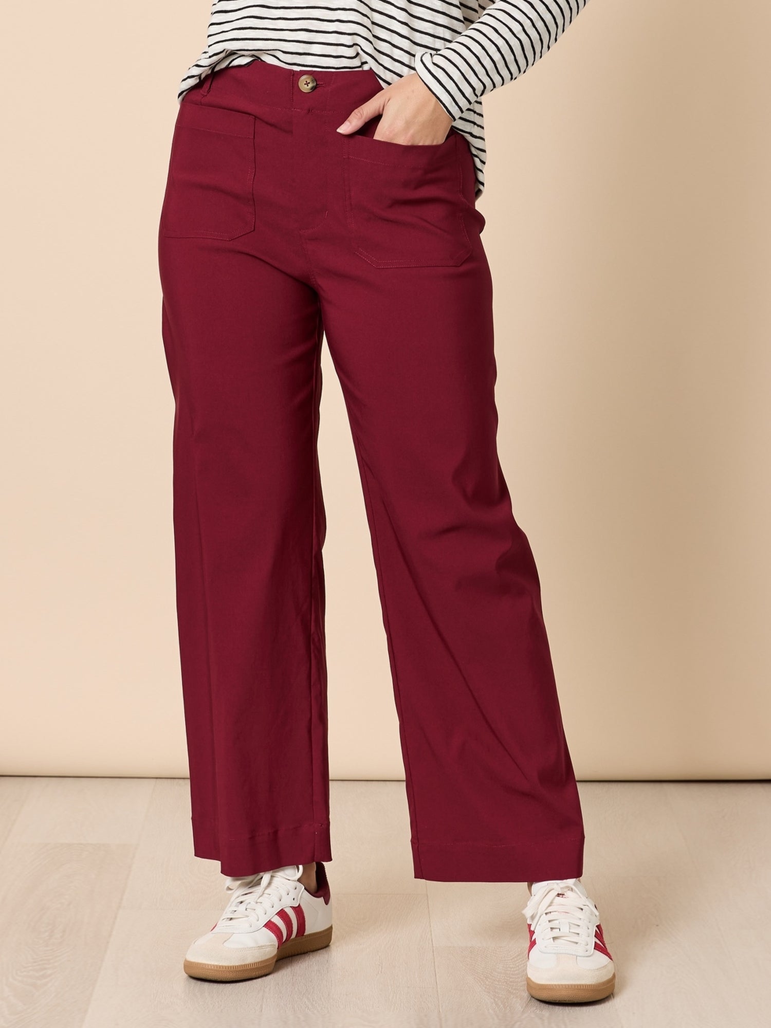 Image of a model wearing Pants. Product name - Marine Wide Leg Pant Shiraz in Shiraz colour by brand - Threadz