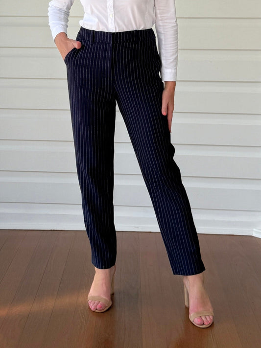 Image of a model wearing Pants. Product name - Beckham Pant Navy/White in Navy/White colour by brand - Gordon Smith
