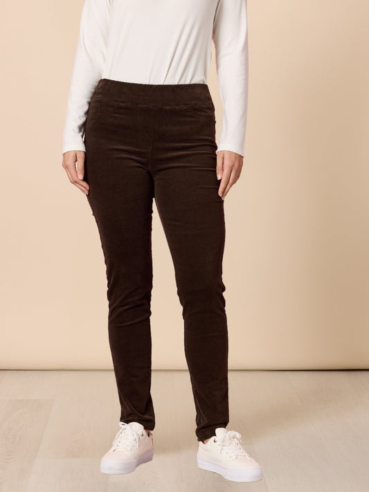 Image of a model wearing Pants. Product name - Harper Slim Leg Cord Pant Coffee in Coffee colour by brand - Gordon Smith