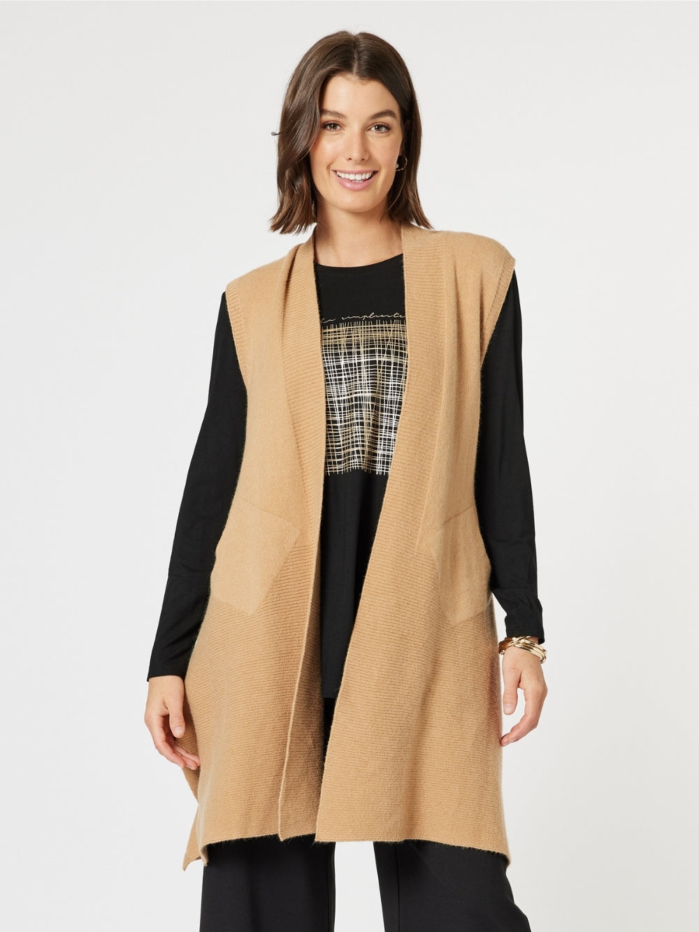 Image of a model wearing Tops. Product name - Casa Knit Vest Caramel in Caramel colour by brand - Clarity