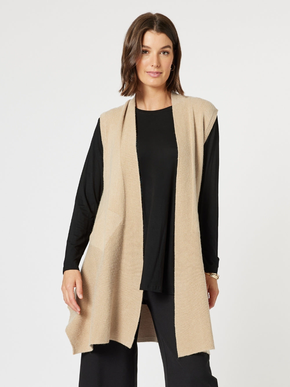 Image of a model wearing Tops. Product name - Casa Knit Vest Natural in Natural colour by brand - Clarity