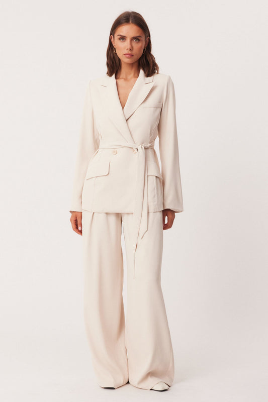 Image of a model wearing Outerwear. Productname: SNDYS RYAN BLAZER in Stone colour by brand - SNDYS