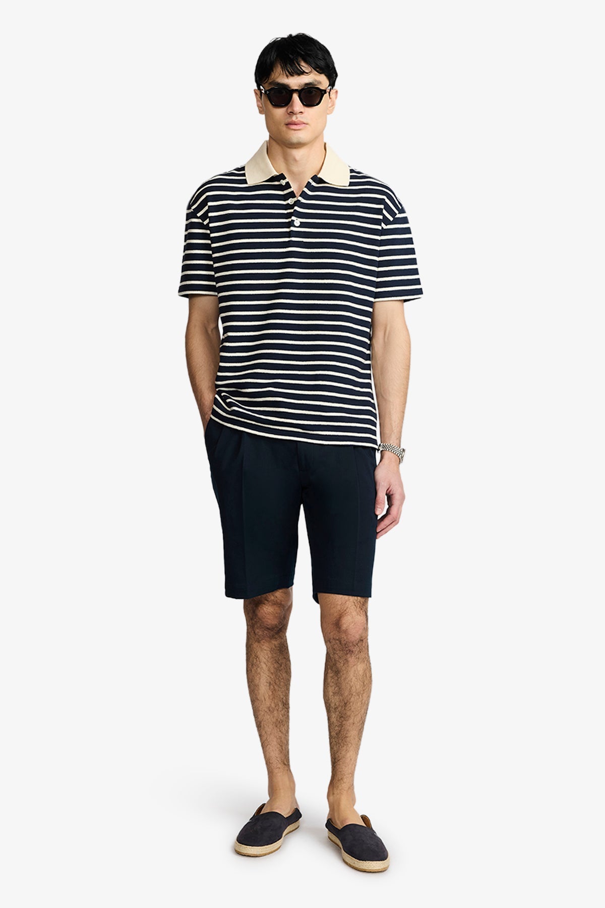 Image of a model wearing Tops. Product name - Ravello Navy/Cream Polo in Navy colour by brand - Anthony Squires
