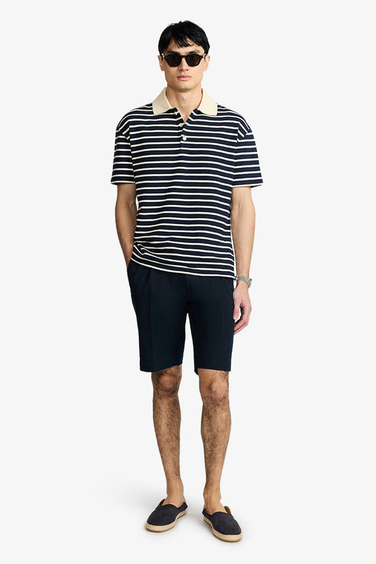 Image of a model wearing Tops. Product name - Ravello Navy/Cream Polo in Navy colour by brand - Anthony Squires