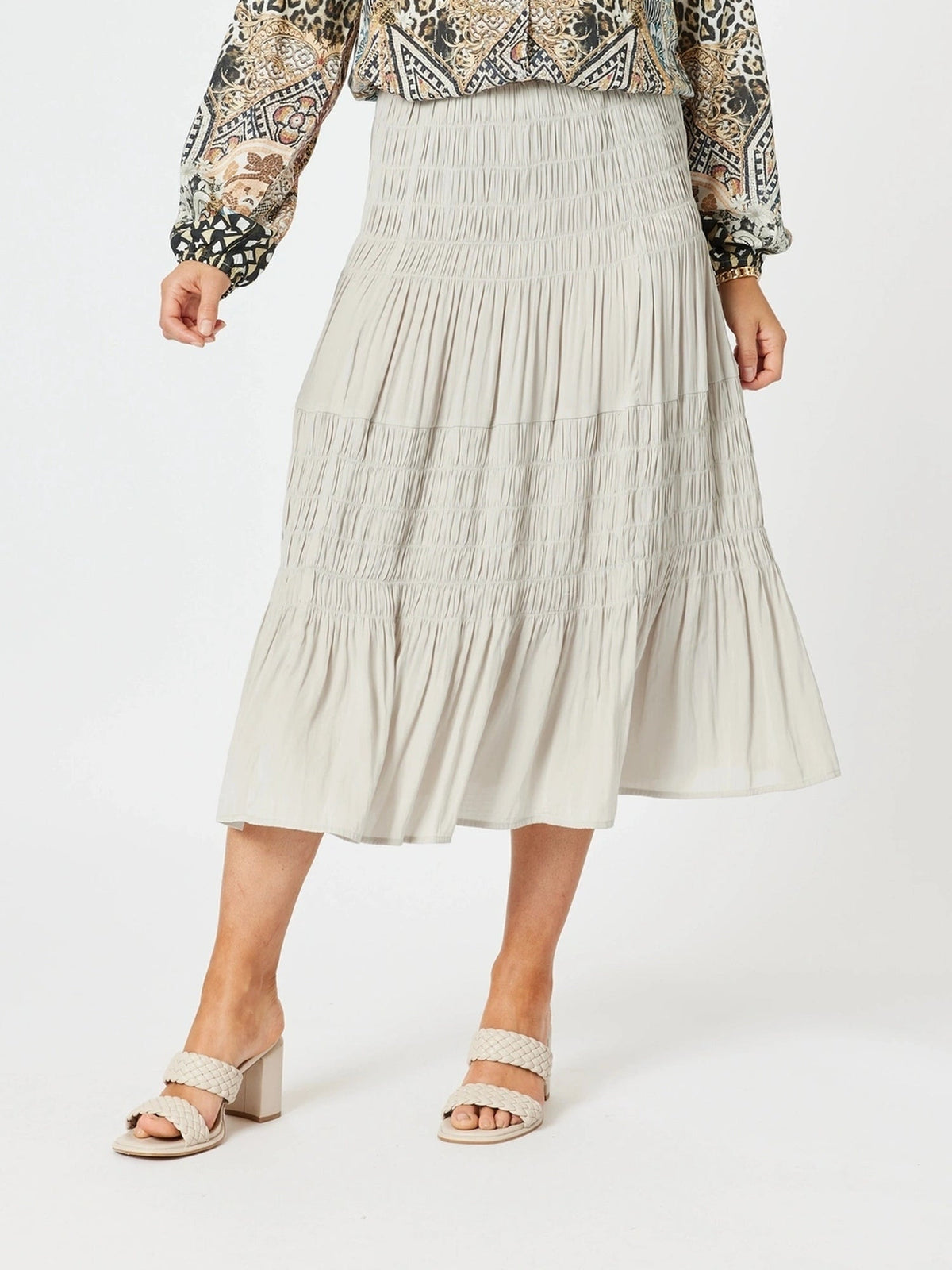 Image of a model wearing Skirts. Product name - Lux Ruche Skirt Champagne in Champagne colour by brand - Hammock & Vine