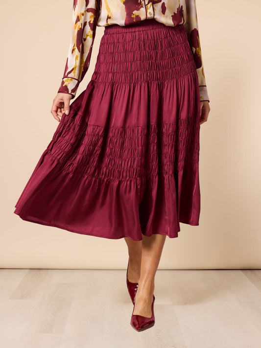 Image of a model wearing Skirts. Product name - Lux Ruche Skirt Shiraz in Shiraz colour by brand - Hammock & Vine