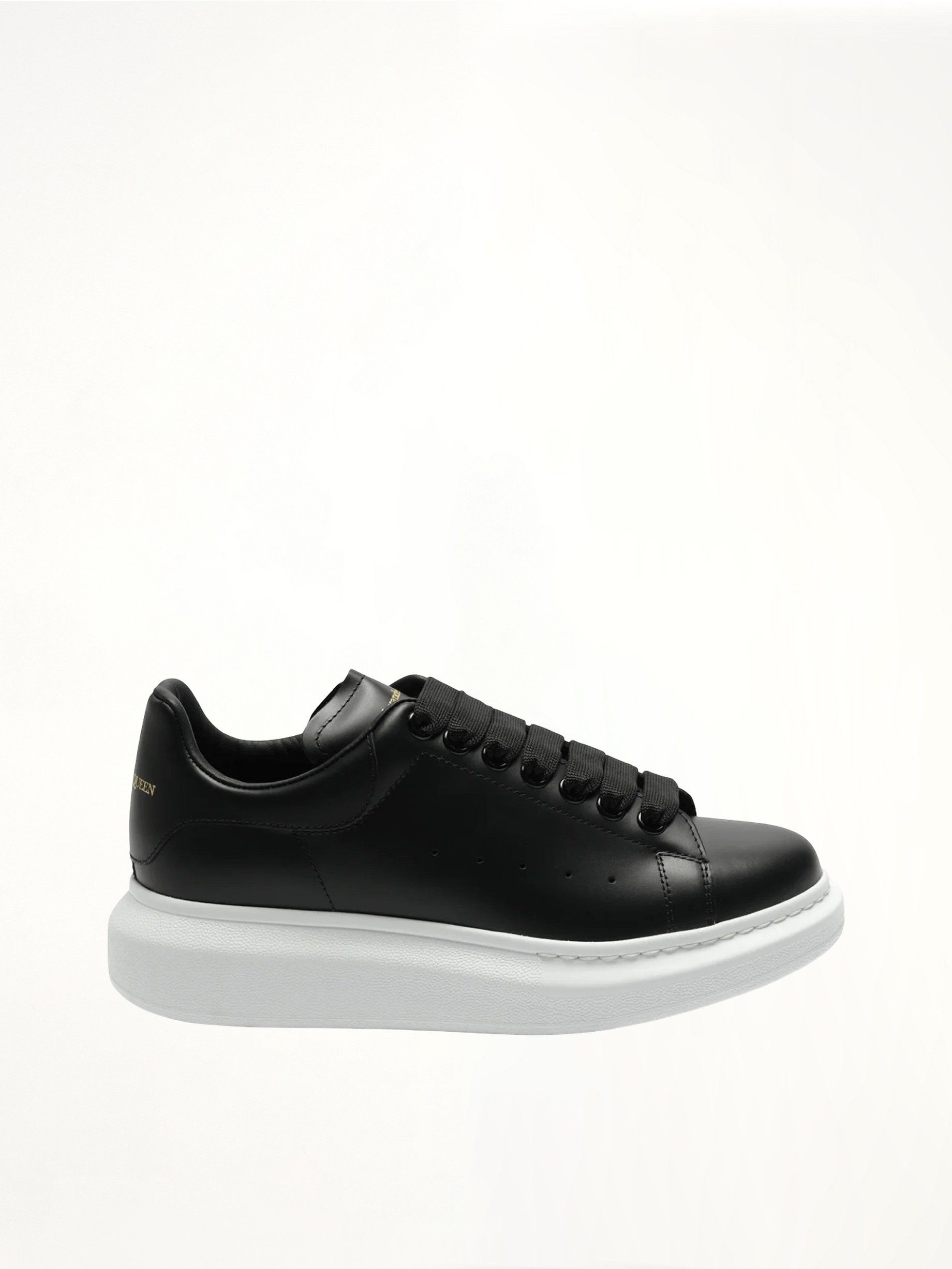 Image of Sneakers. Product name - Larry Oversized Sneakers in Black colour by brand - ALEXANDER MCQUEEN