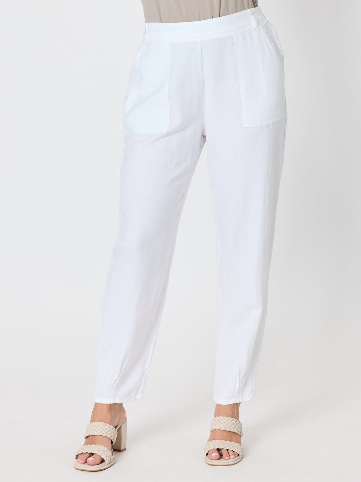 Image of a model wearing Pants. Product name - Lino Tapered Pant White in White colour by brand - Gordon Smith