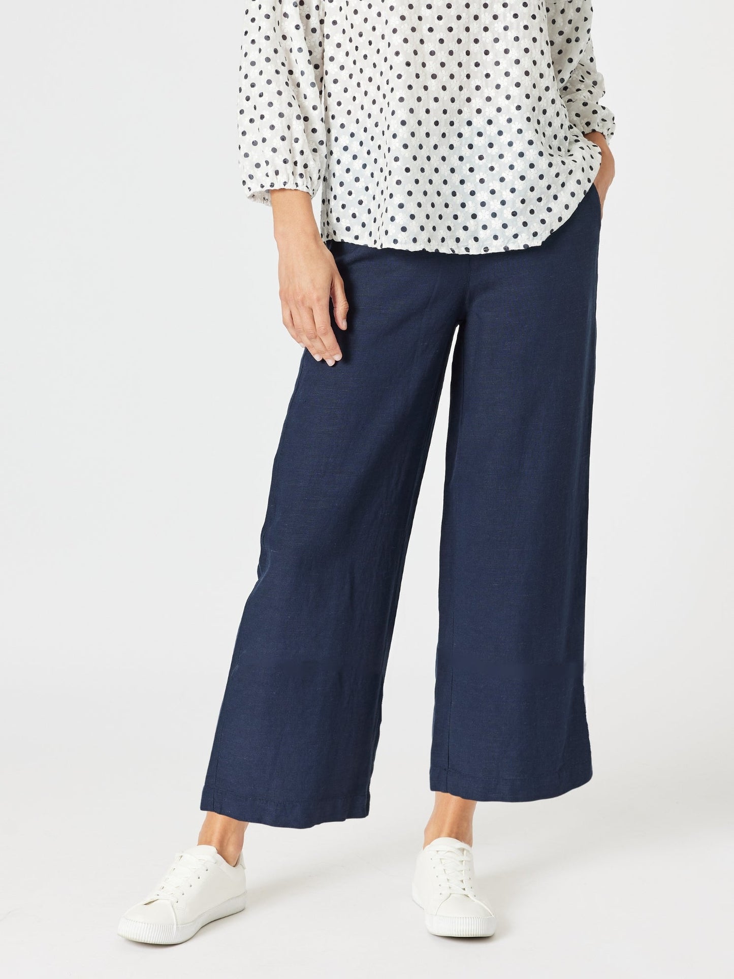 Image of a model wearing Pants. Product name - Lino Wide Leg Pant Navy in Navy colour by brand - Gordon Smith