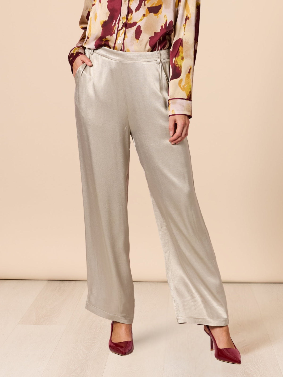 Image of a model wearing Pants. Product name - Opera Pant Champagne in Champagne colour by brand - Hammock & Vine