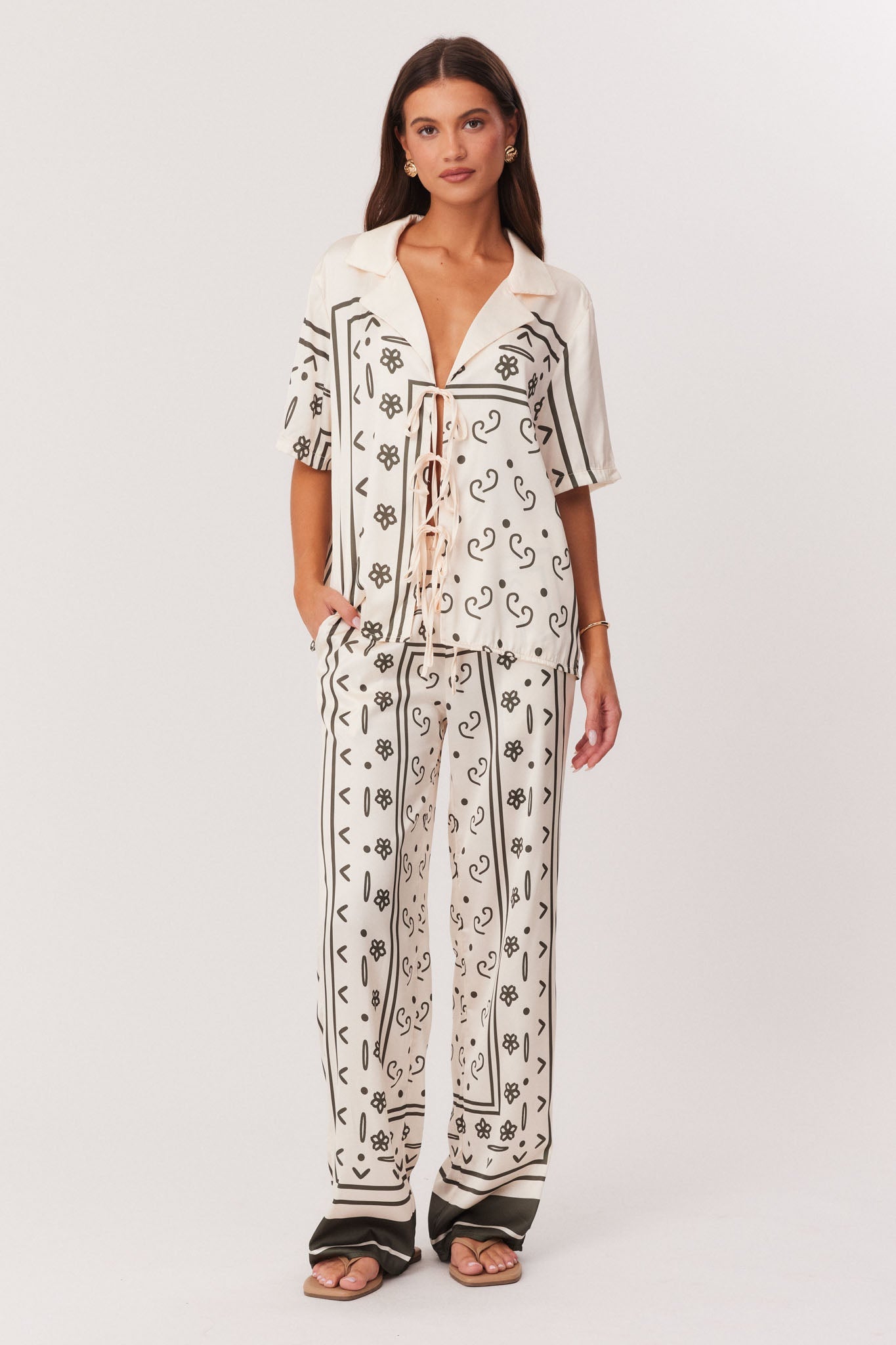 Image of a model wearing Pants. Productname: SNDYS SILAS PANTS in Boho Print colour by brand - SNDYS