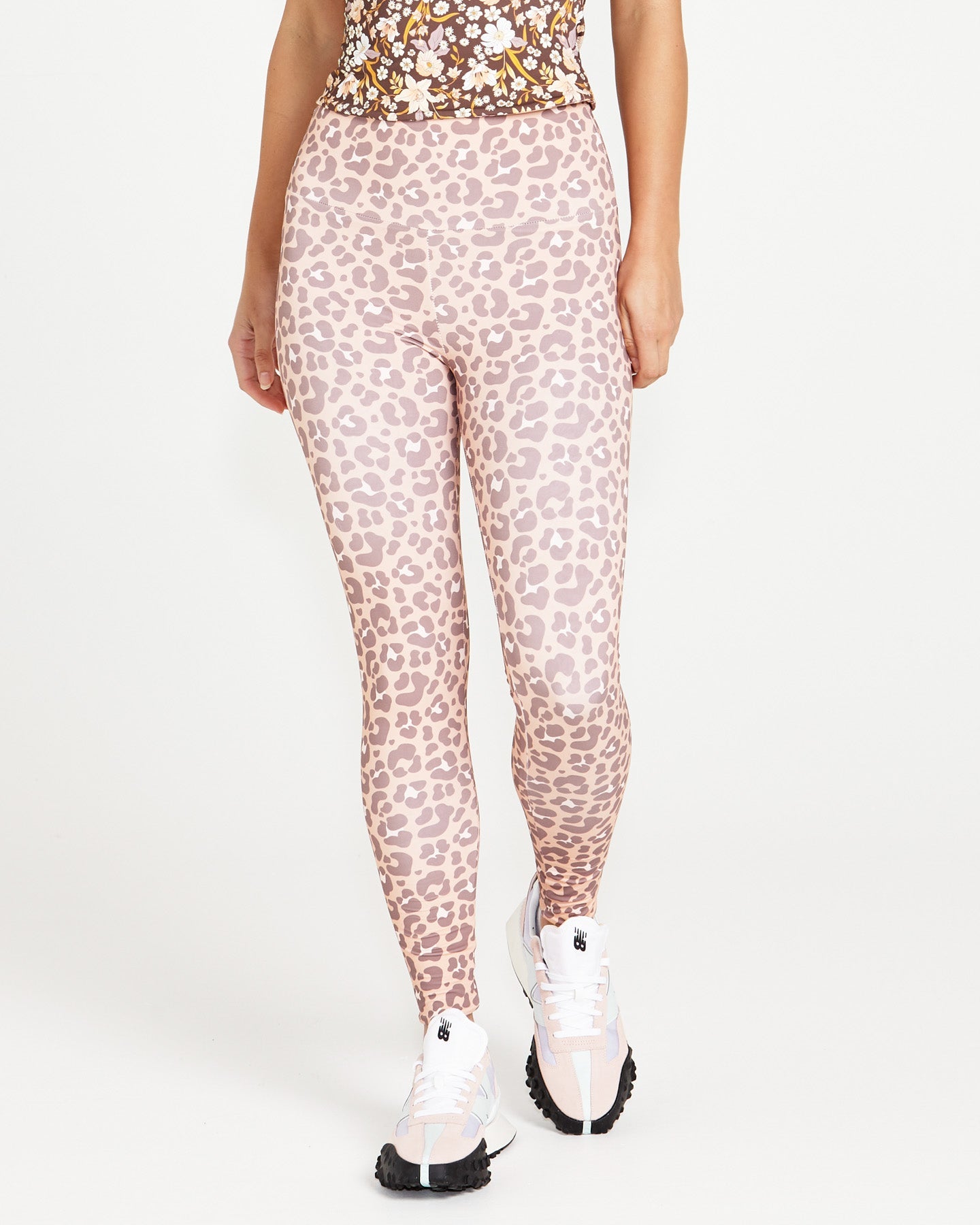 Image of a model wearing Pants. Product name - Alessia Reversible Active Tights Chocolate Floral/Pink Cheetah in Chocolate Floral/Pink Cheetah colour by brand - Sass Clothing