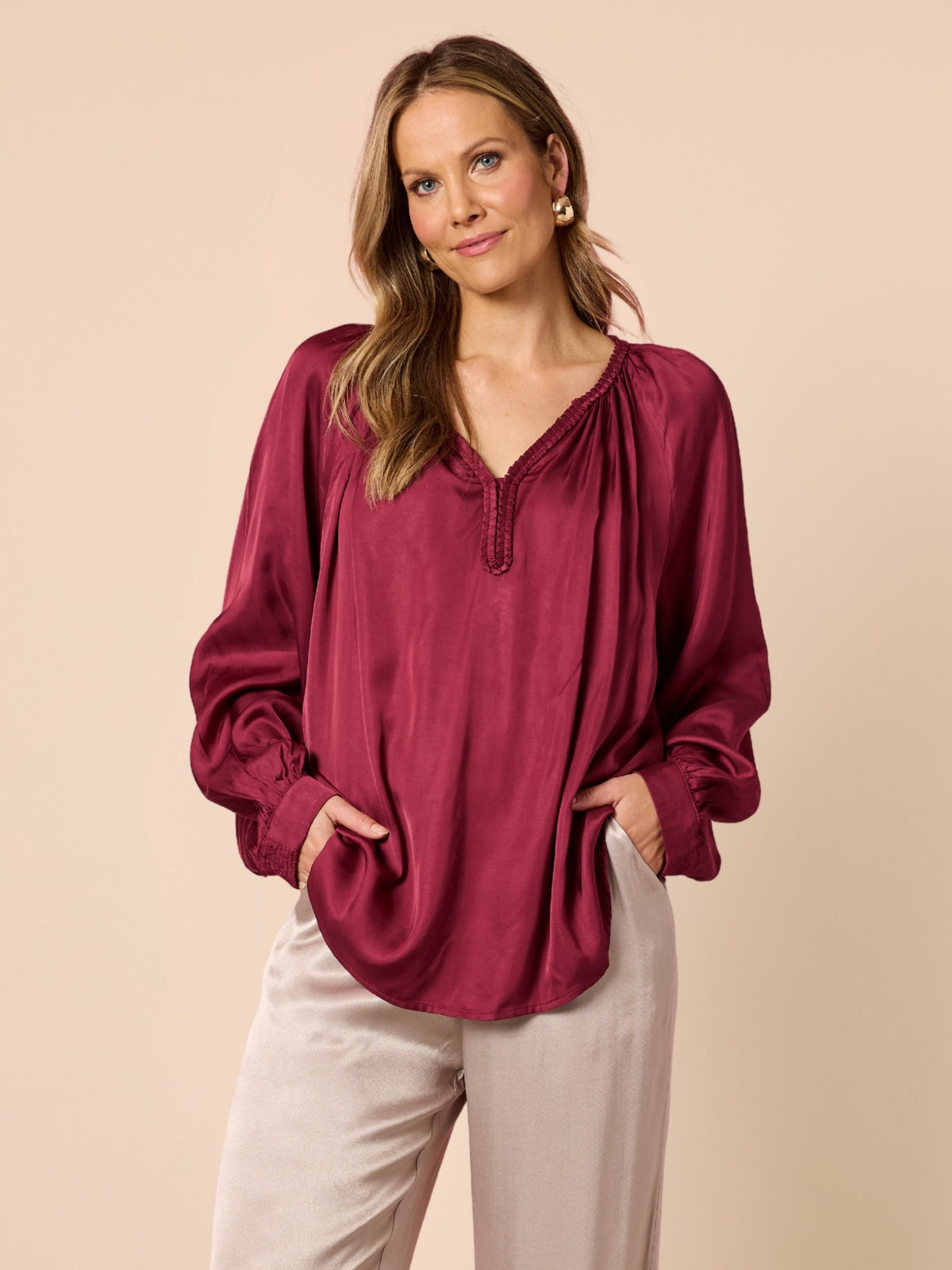 Image of a model wearing Tops. Product name - Lux Plait Top Shiraz in Shiraz colour by brand - Hammock & Vine