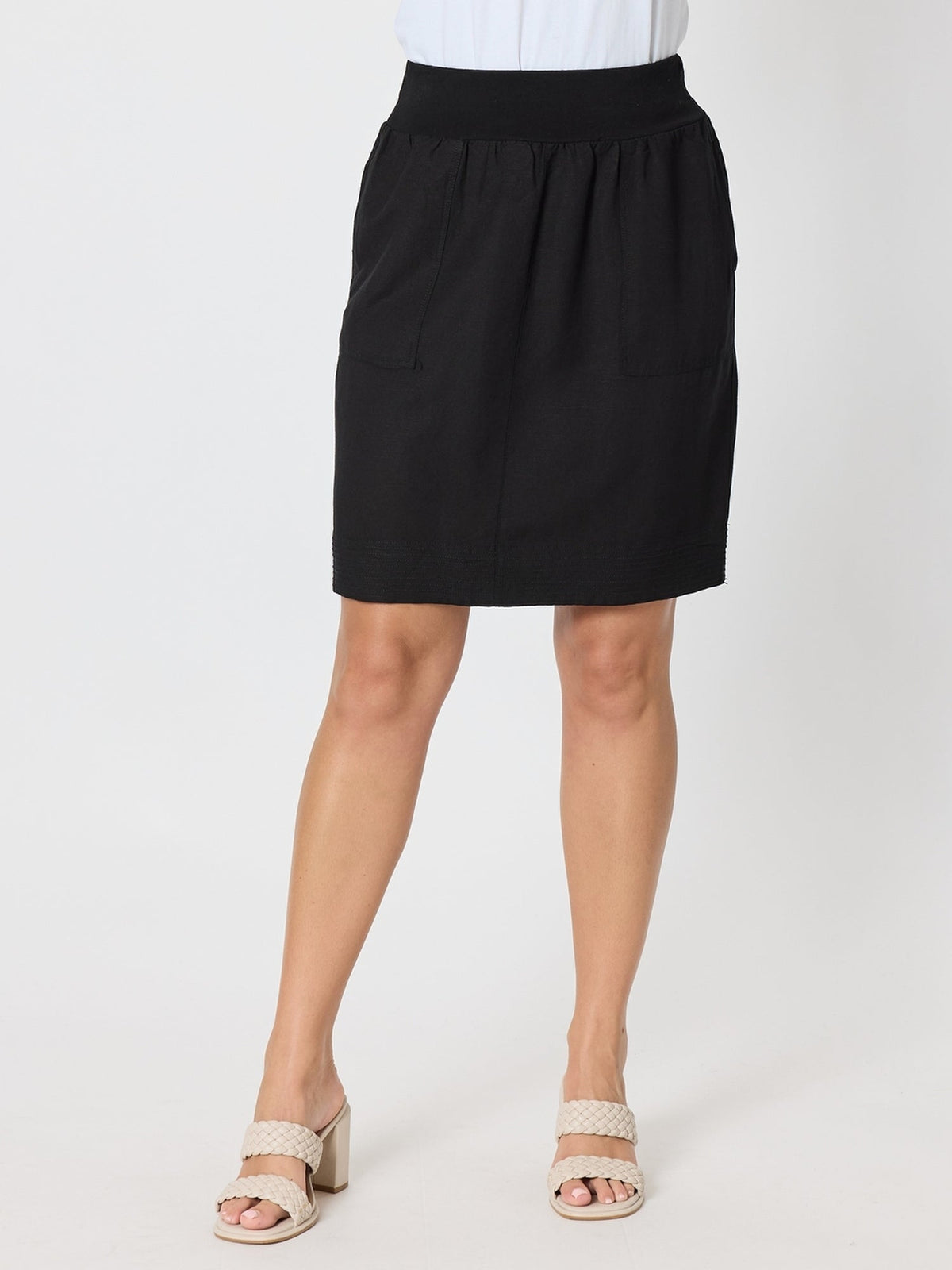 Image of a model wearing Skirts. Product name - Lino Stitch Hem Detail Skirt Black in Black colour by brand - Gordon Smith