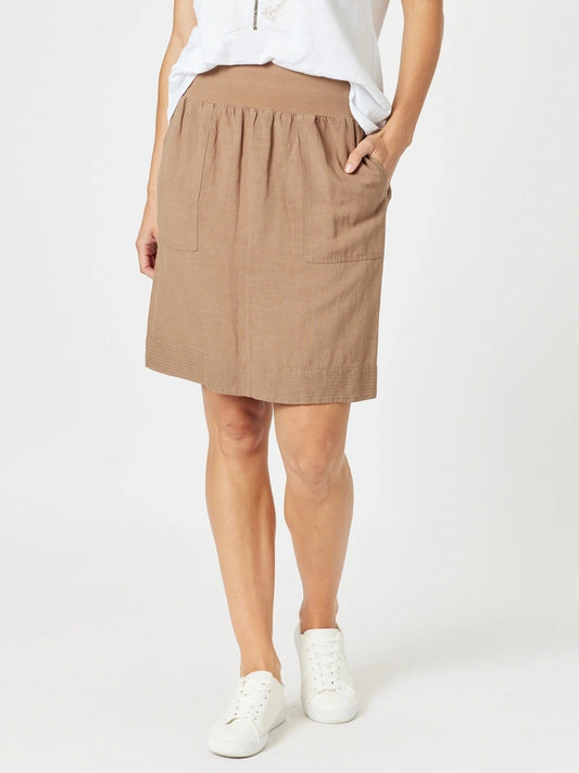 Image of a model wearing Skirts. Product name - Lino Stitch Hem Detail Skirt Nutmeg in Nutmeg colour by brand - Gordon Smith