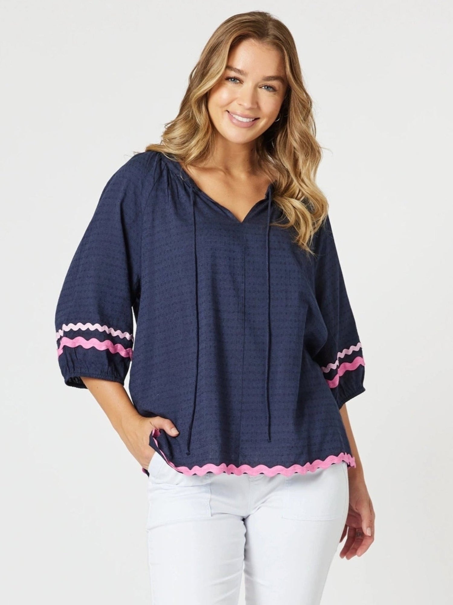 Image of a model wearing Tops. Product name - Ric Rac Top Navy in Navy colour by brand - Threadz