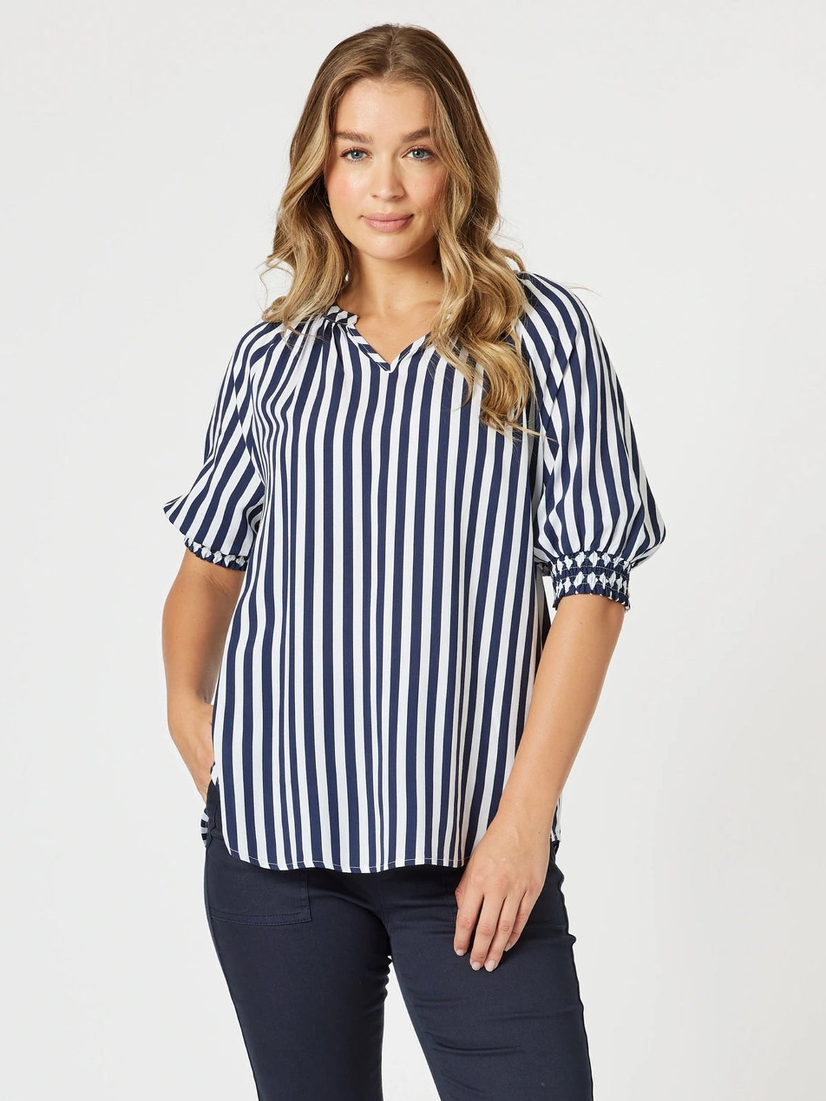 Image of a model wearing Tops. Product name - Harlequin Stripe Print Top Navy/White in Navy/White colour by brand - Threadz