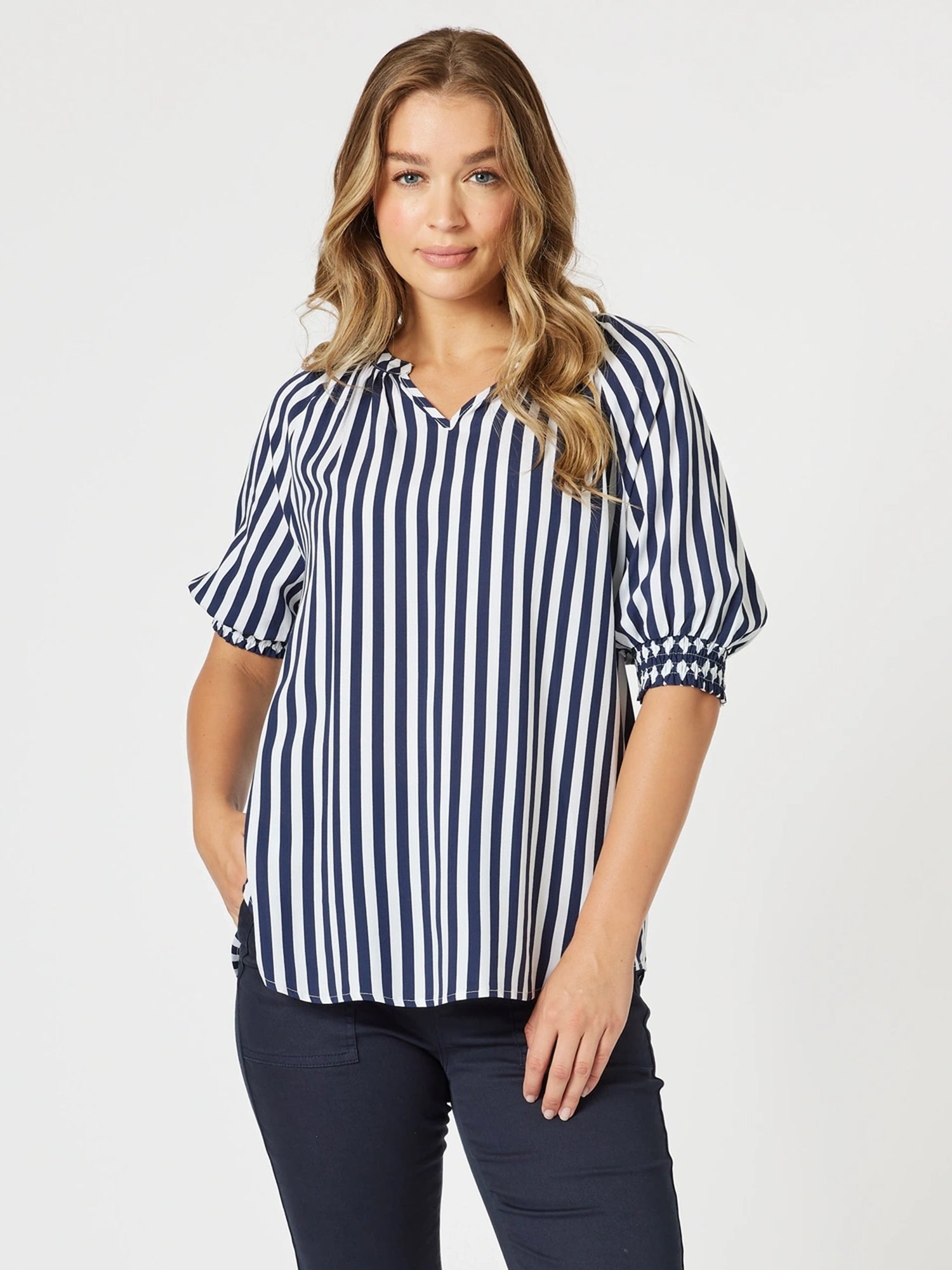 Image of a model wearing Tops. Product name - Harlequin Stripe Print Top Navy/White in Navy/White colour by brand - Threadz