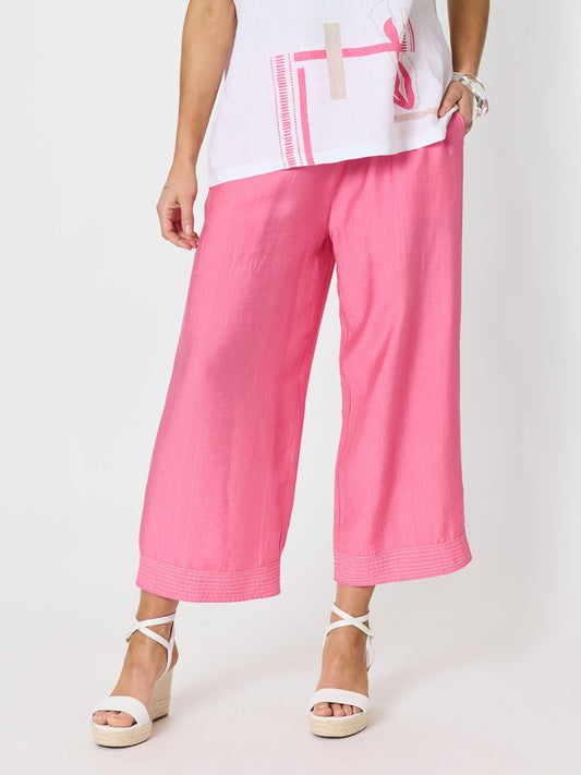 Image of a model wearing Tops. Product name - Top Stitch Pant Candy in Candy colour by brand - Clarity