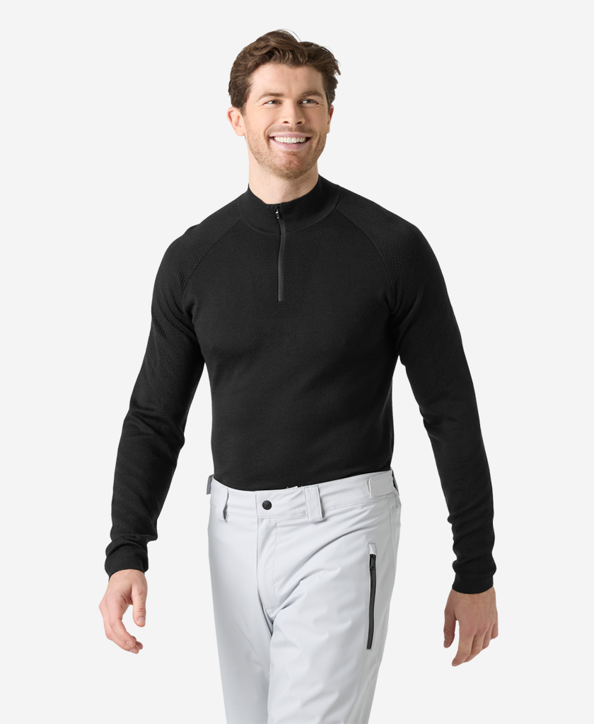 Image of a model wearing Tops. Product name - LIFA MERINO KNITEVO 1/2 ZIP, Black in Black colour by brand - Helly Hansen