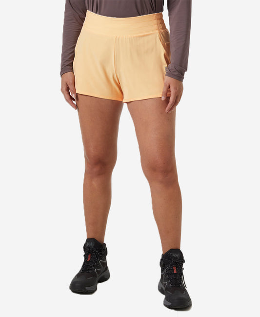 Image of a model wearing Shorts. Product name - W TECH TRAIL SHORTS, Miami Peach in Miami Peach colour by brand - Helly Hansen