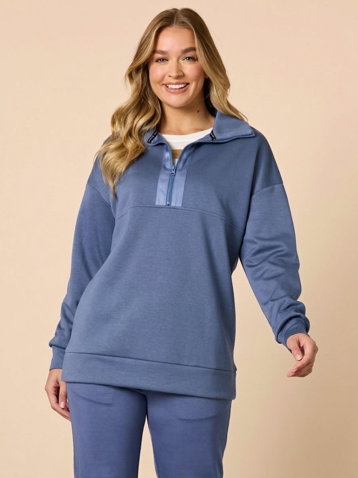 Image of a model wearing Outerwear. Product name - Urban City Quarter Zip Sweatshirt Denim Blue in Denim Blue colour by brand - Threadz