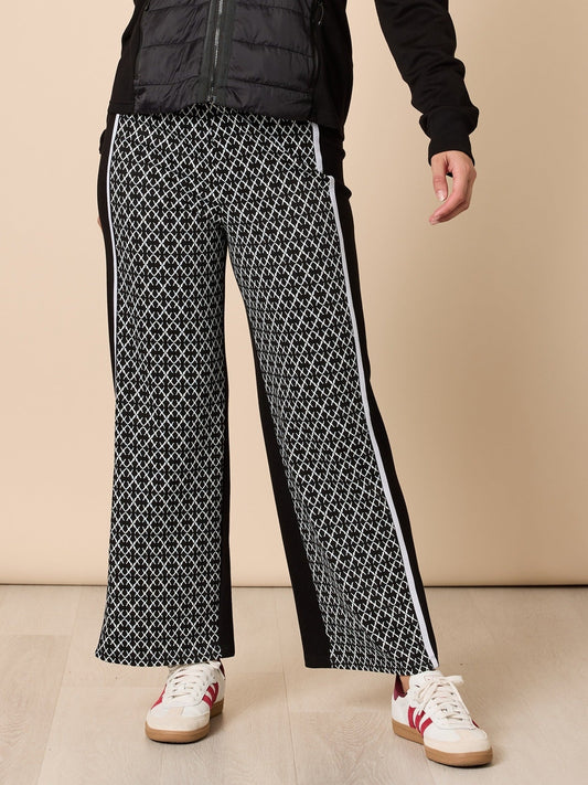 Image of a model wearing Pants. Product name - Empire Spliced Pant Black/Ivory in Black/Ivory colour by brand - Threadz