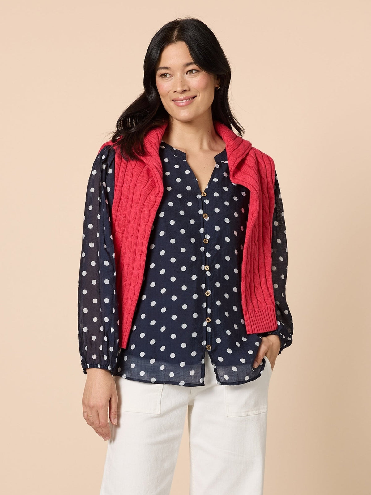 Image of a model wearing Tops. Product name - Aurora Spot Print Sheer Top Navy/White in Navy/White colour by brand - Gordon Smith