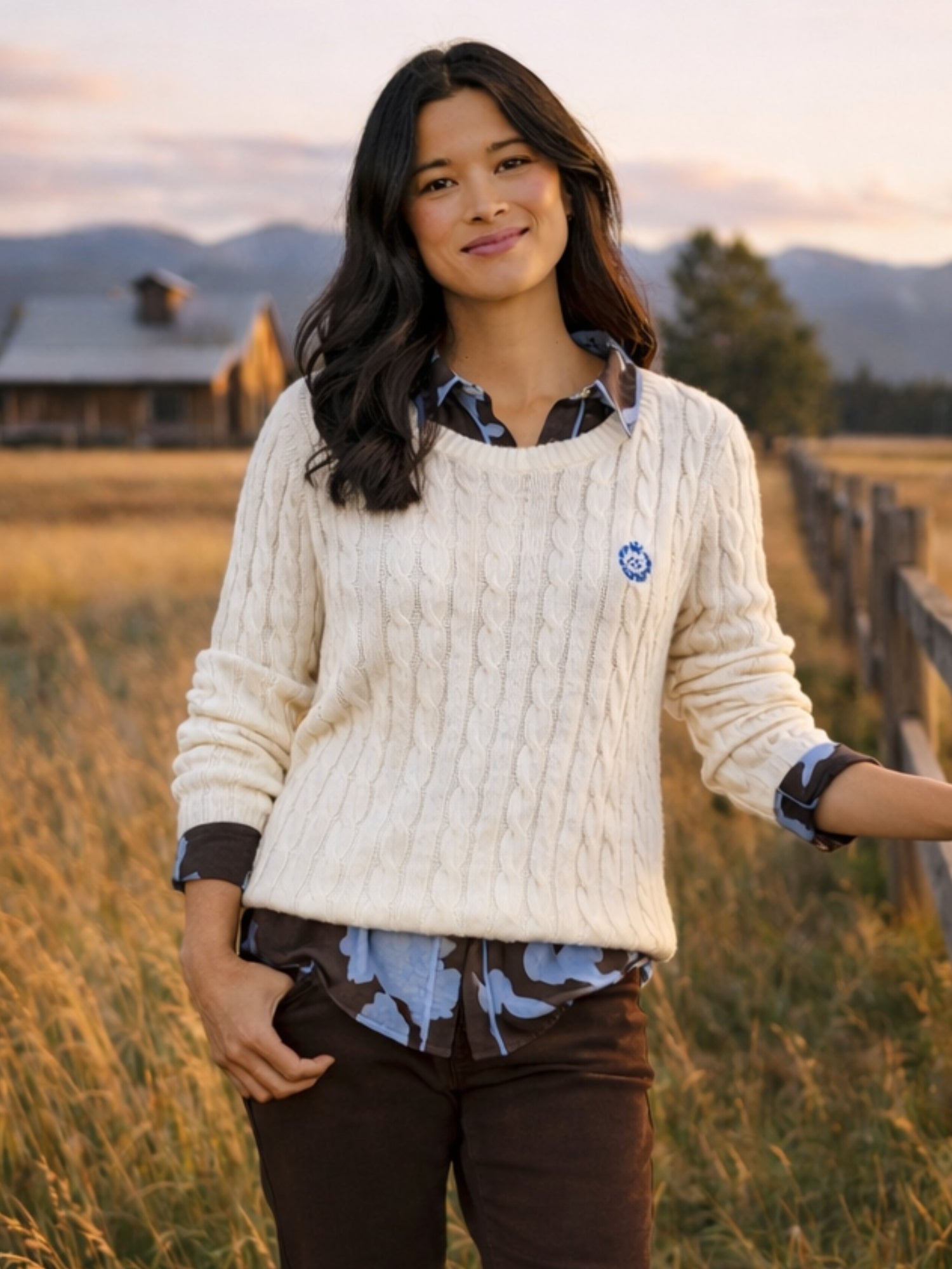 Image of a model wearing Tops. Product name - Hampton Cable Jumper Ivory in Ivory colour by brand - Gordon Smith