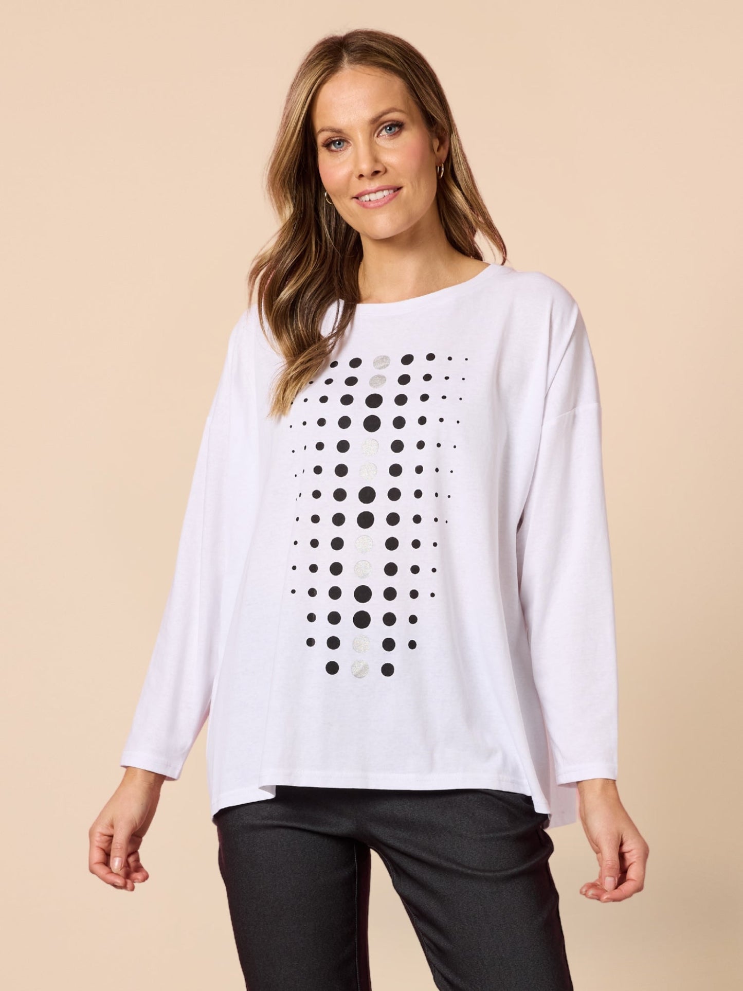 Image of a model wearing Tops. Product name - Elise Spot Top White in White colour by brand - Clarity