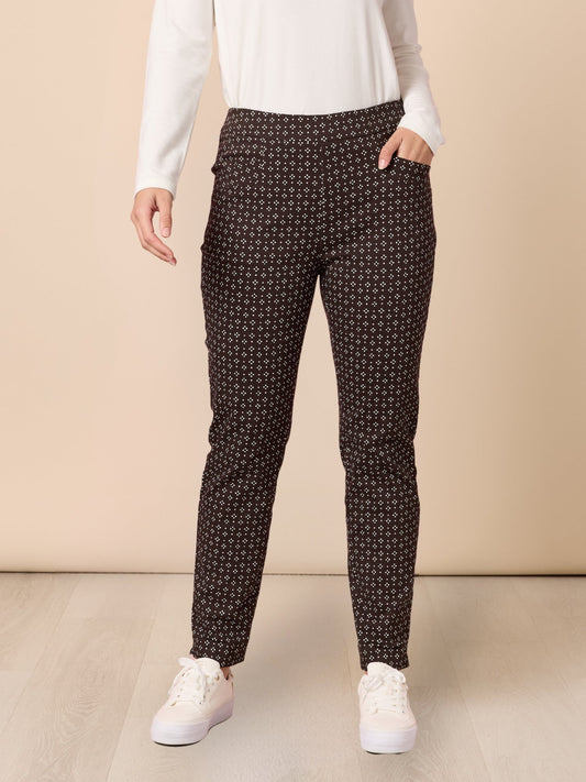 Image of a model wearing Pants. Product name - Kelly Print Pant Coffee in Coffee colour by brand - Gordon Smith