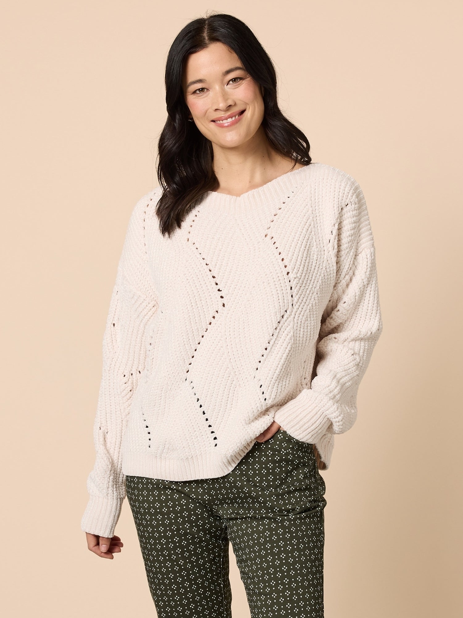 Image of a model wearing Tops. Product name - Tenille Knit Ivory in Ivory colour by brand - Gordon Smith