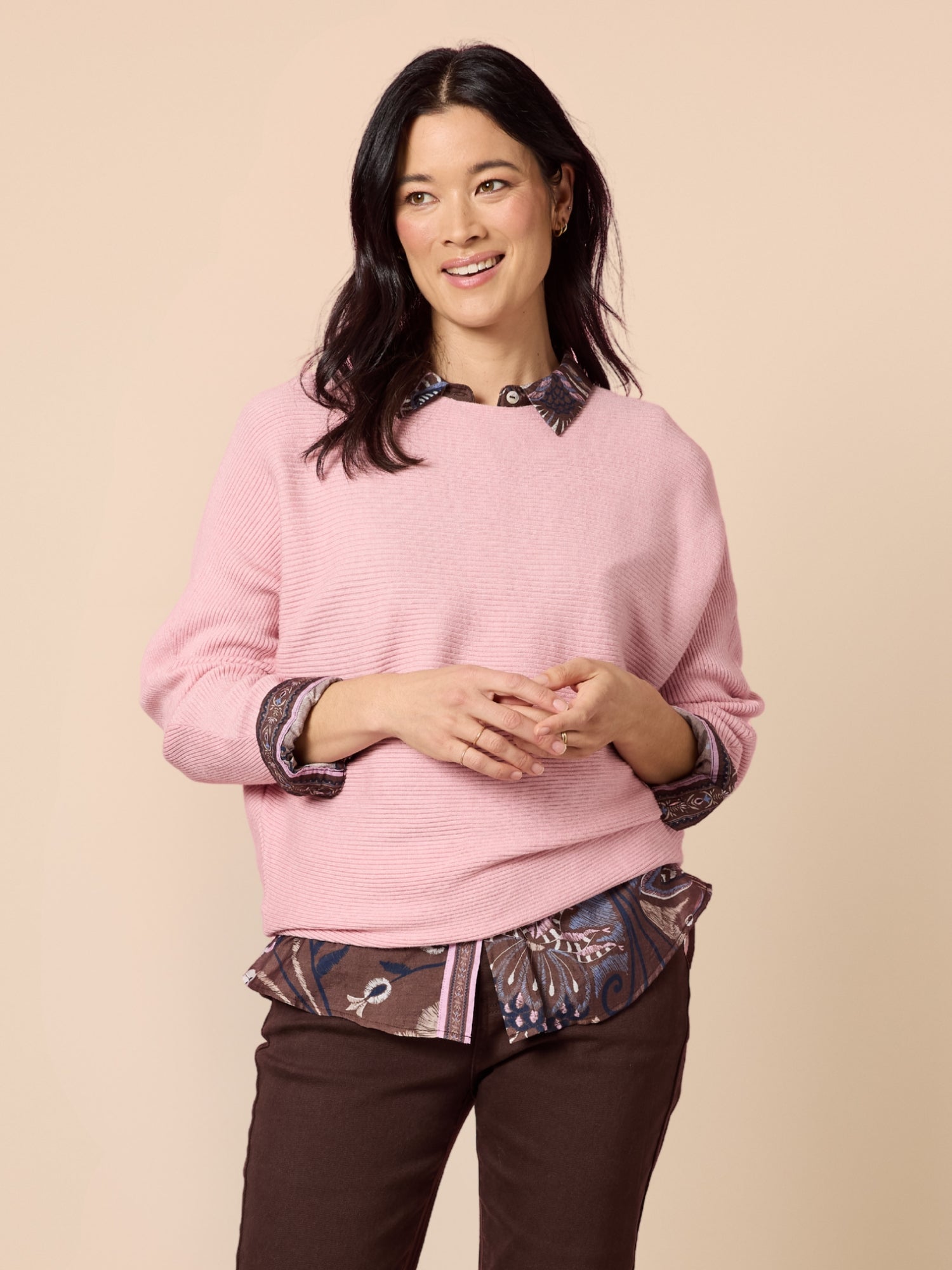Image of a model wearing Tops. Product name - Billie Ribbed Knit Blush in Blush colour by brand - Gordon Smith