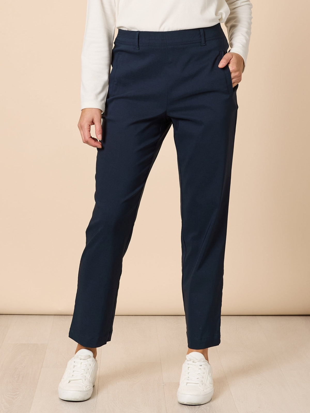 Image of a model wearing Pants. Product name - Evie Stretch Pant Navy in Navy colour by brand - Threadz