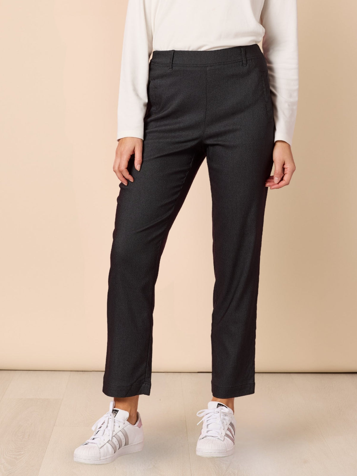 Image of a model wearing Pants. Product name - Evie Stretch Pant Charcoal in Charcoal colour by brand - Threadz