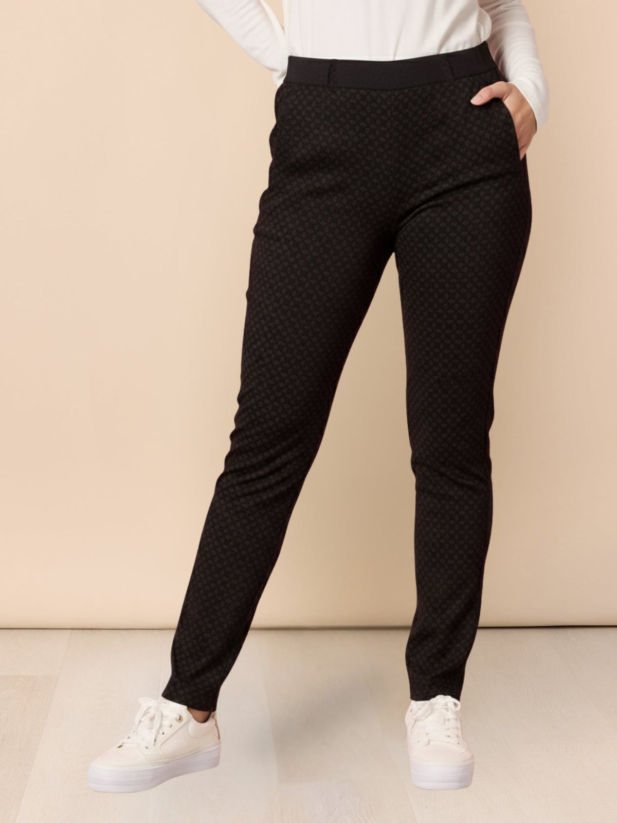Image of a model wearing Pants. Product name - Hunter Print Pant Coffee Multi in Coffee Multi colour by brand - Gordon Smith