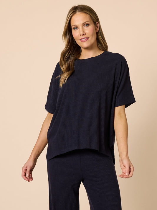 Image of a model wearing Tops. Product name - Le Lounge Top Navy in Navy colour by brand - Clarity