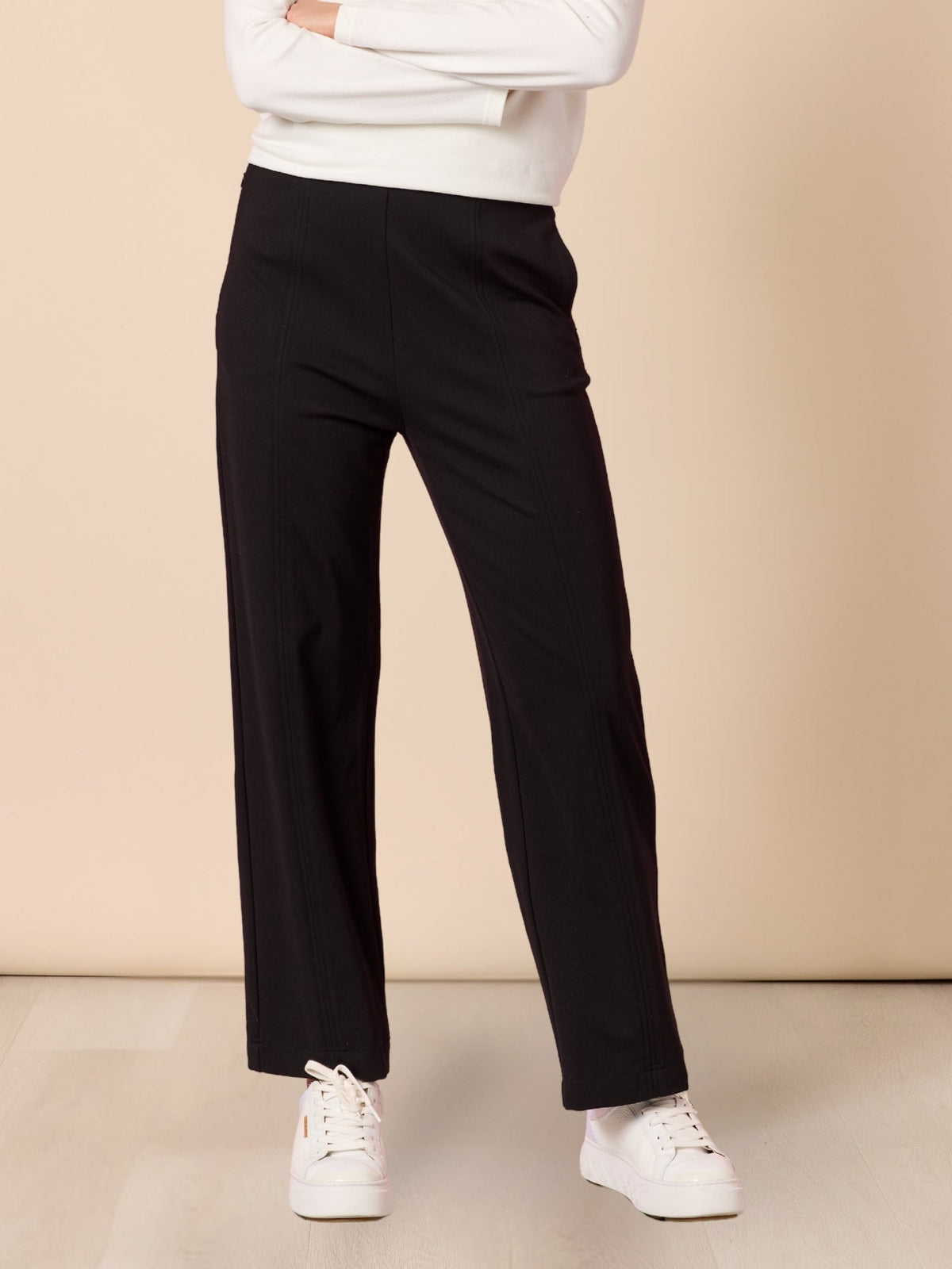 Image of a model wearing Pants. Product name - Pippa Pant Black in Black colour by brand - Hammock & Vine