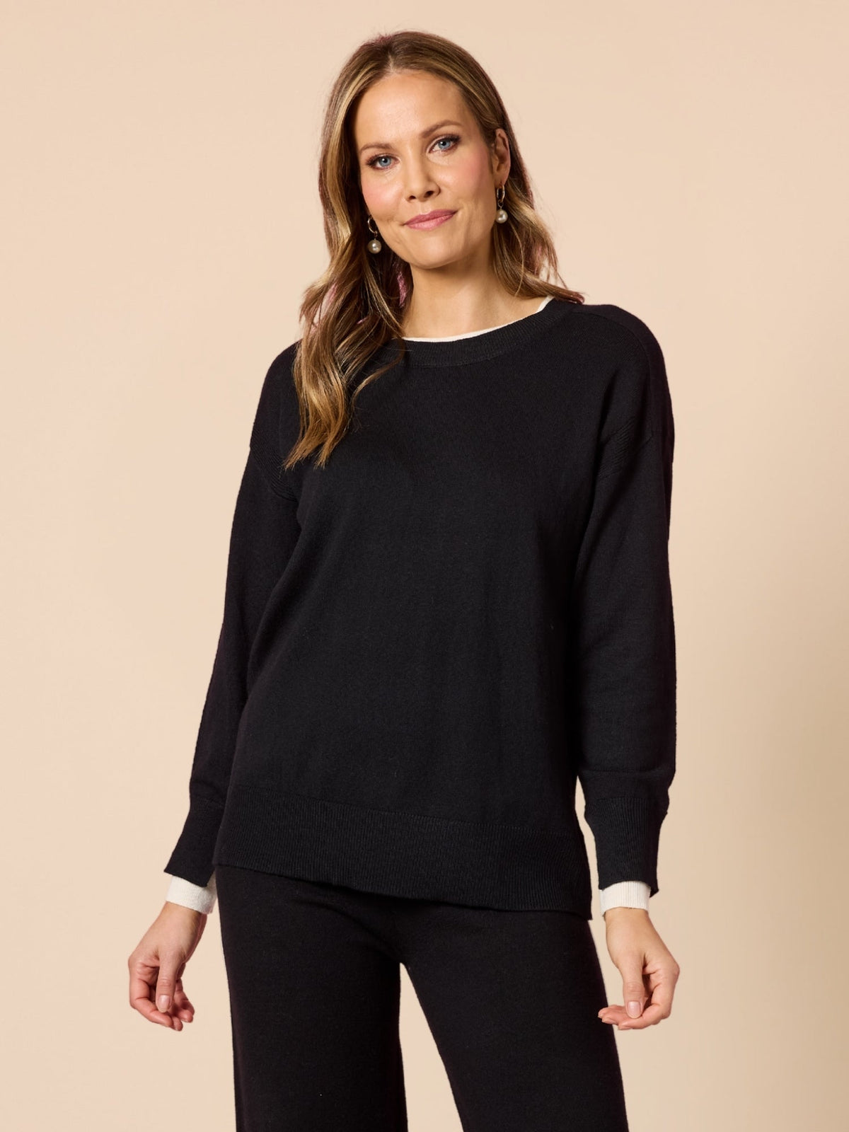 Image of a model wearing Tops. Product name - Sofia Knit Black/Ivory in Black/Ivory colour by brand - Hammock & Vine
