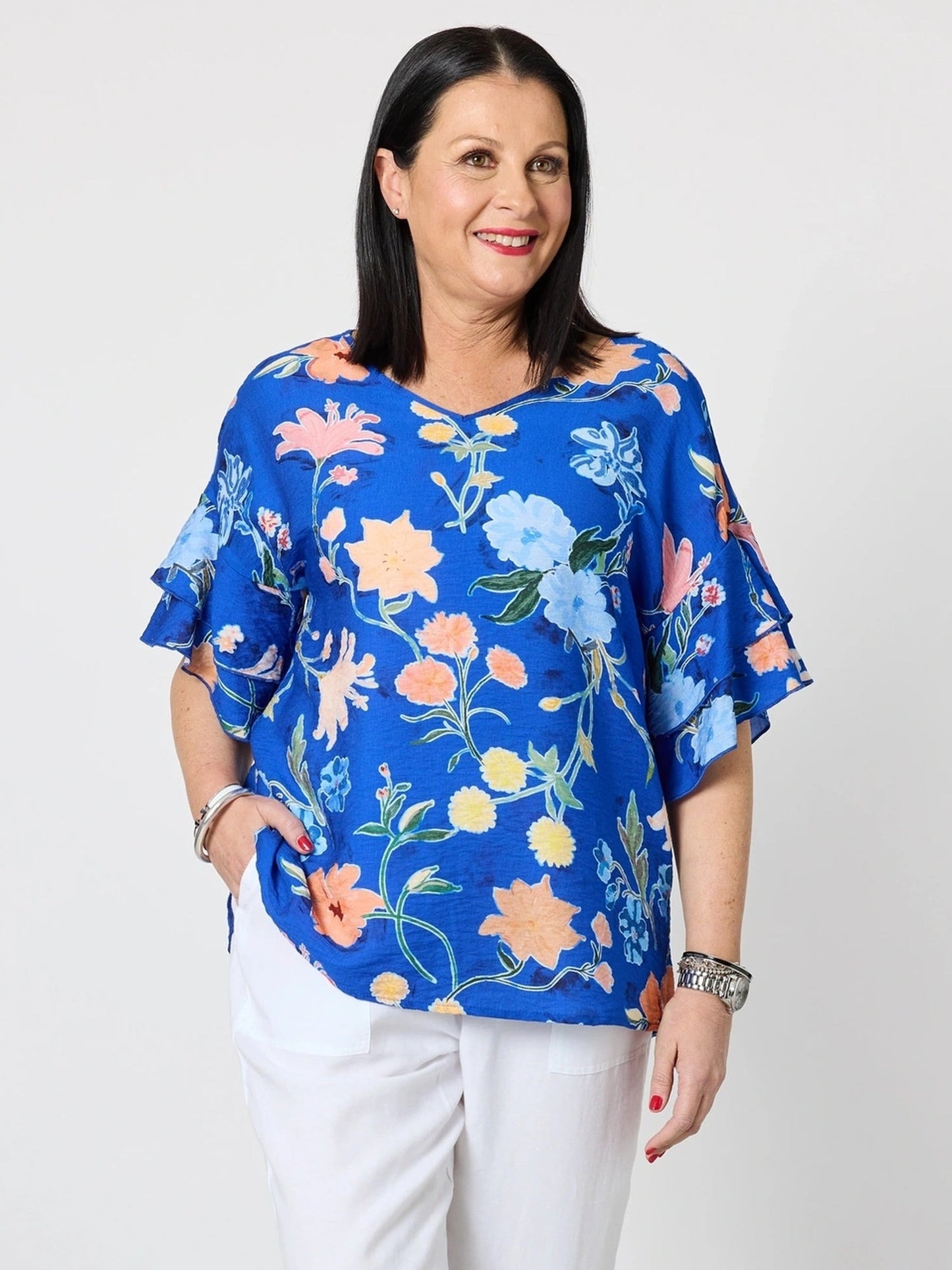 Image of a model wearing Tops. Product name - Summer Gala Floral Print Top Cobalt in Cobalt colour by brand - Clarity
