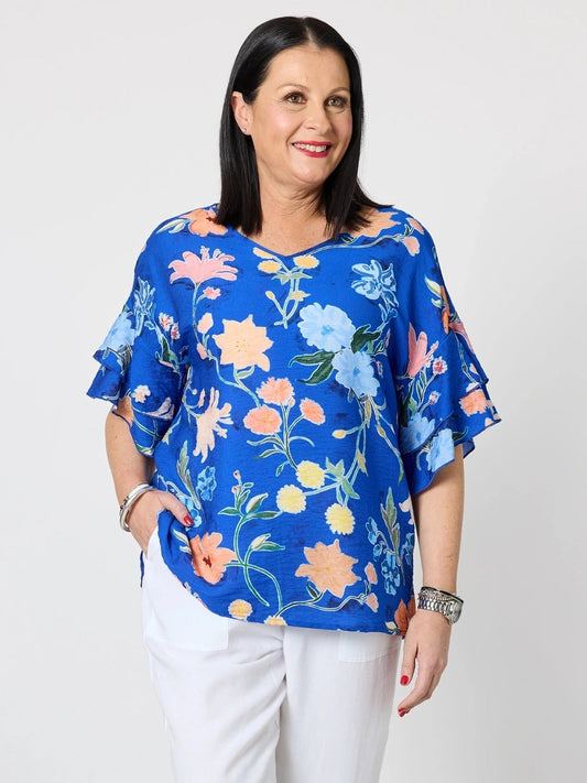 Image of a model wearing Tops. Product name - Summer Gala Floral Print Top Cobalt in Cobalt colour by brand - Clarity